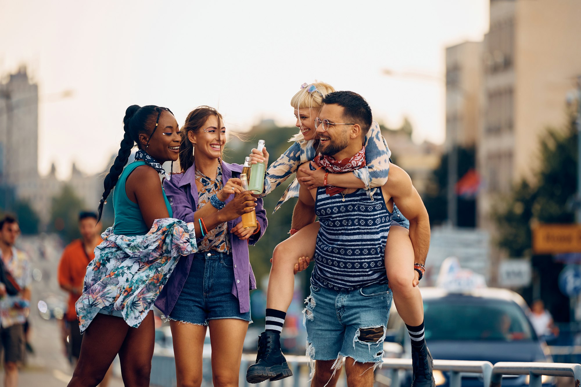 cheerful-friends-toasting-with-drinking-while-going-on-open-air-music-festival-.jpg